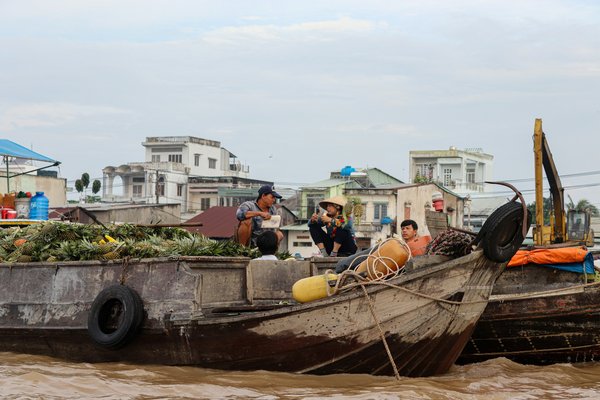 Comment planifier une visite des marchés flottants sur le fleuve Mékong au Vietnam ?